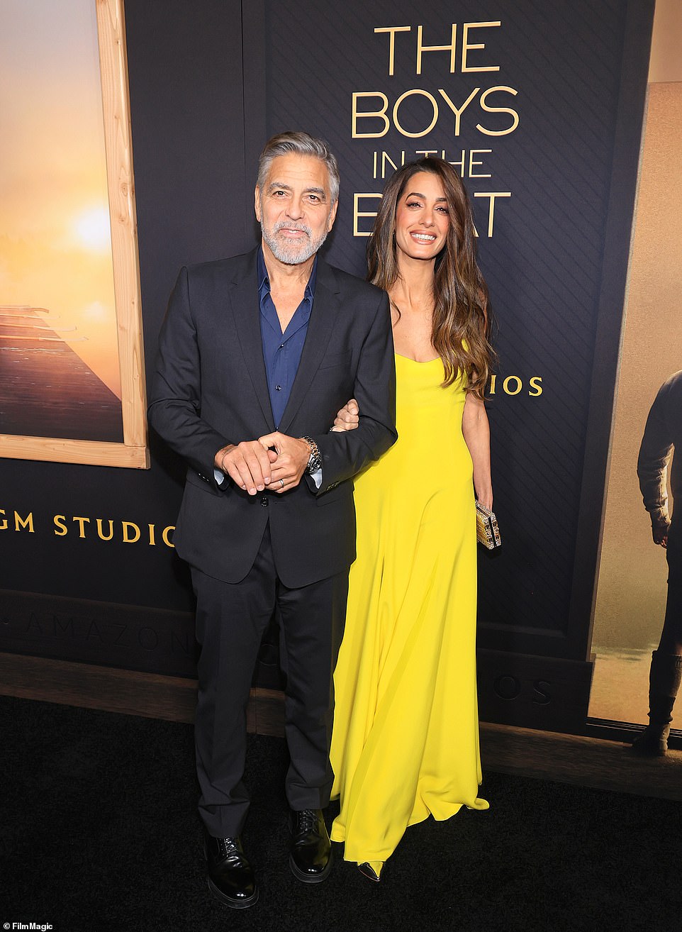 В среду от Клуни пропала его девятилетняя жена Амаль Аламуддин (справа), которая нарядилась в желтое платье Versace на премьеру своего фильма в Беверли-Хиллз в понедельник.